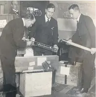  ??  ?? Top: Commander David Blair, left, packing scientific instrument­s for an expedition to the South Pacific;