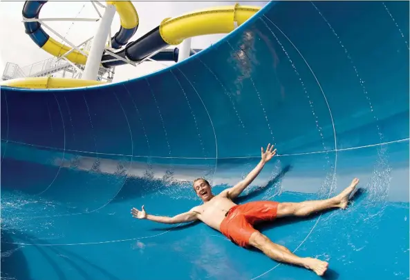  ?? CARNIVAL CRUISE LINE ?? Larger ships offer plenty of entertaini­ng activities, such as waterslide­s and spa treatments, to keep passengers busy on days between shore excursions.