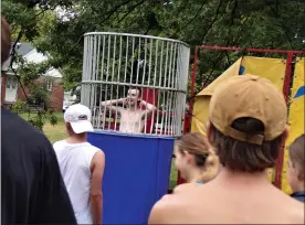  ?? BOB KEELER — MEDIANEWS GROUP ?? Dan Malley, one of the Souderton Community Pool managers, stands in the Community Night dunk tank after having been dunked.