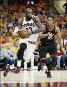  ?? TONY DEJAK — THE ASSOCIATED PRESS ?? Cleveland’s LeBron James (23) drives past Toronto’s DeMar DeRozan (10) in the second half in Game 1 of a second-round playoff series Monday in Cleveland.