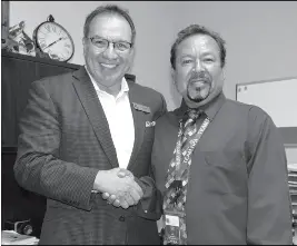  ?? Buy this photo at YumaSun.com PHOTO BY CESAR NEYOY/BAJO EL SOL ?? JOSE LUIS REYNOSO (RIGHT), seen here with Mario Ybarra, vice president of Harvest Preparator­y Academy, is the new principal of the charter school’s San Luis campus.