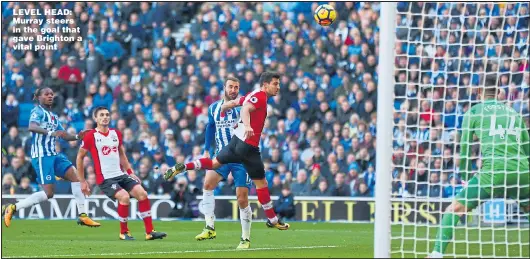  ?? Main picture: STEVE BARDENS ?? LEVEL HEAD: Murray steers in the goal that gave Brighton a vital point