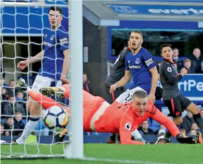  ?? AP ?? Arsenal’s Alexis Sanchez (right) scores his side’s fifth goal against Everton during the Premier League match at the Goodison Park. —