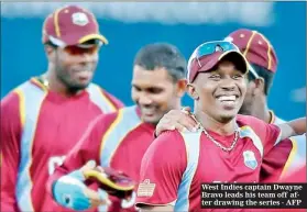  ??  ?? West Indies captain Dwayne Bravo leads his team off after drawing the series - AFP