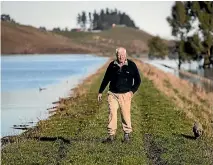  ?? GEORGE HEARD/STUFF ?? John Parks’ Taieri Plains farm was 90 per cent under water.
