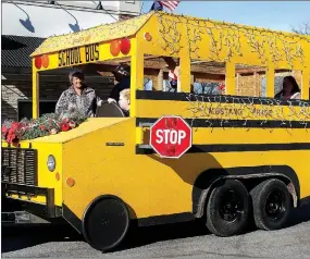  ?? MEGAN DAVIS MCDONALD COUNTY PRESS MEGAN DAVIS MCDONALD
COUNTY PRESS ?? A one-of-a-kind school bus even made an appearance to show the town’s “Mustang Pride” during the Southwest City parade on Dec. 5, 2015.