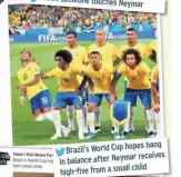  ??  ?? hang Brazil’s World Cup hopes receives in balance after Neymar child high-five from a small