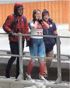  ?? ERIC SEALS/ USA TODAY SPORTS ?? U.S. luger Emily Sweeney walks off the run after crashing in the luge single event Tuesday.