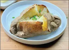  ?? (Arkansas Democrat-Gazette/Kelly Brant) ?? Baking potatoes following the “British” method produces spuds with fluffy flesh and crackling crisp skin.
