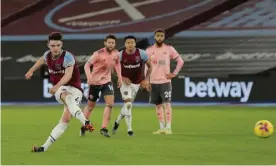  ?? Photograph: Tom Jenkins/ NMC Pool/The Guardian ?? Declan Rice converts his penalty to give West Ham the lead.