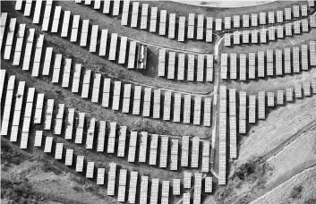  ?? Reuters photo ?? An array of solar panels are seen in Oakland, California.