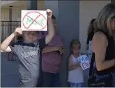  ?? SHARON MARTIN — ENTERPRISE-RECORD ?? Luke Groch, 9, holds up a sign against masks during the “Unmask our Kids” rally held by the Chico Parents for In-Person Learning group Wednesday at Pleasant Valley High School.