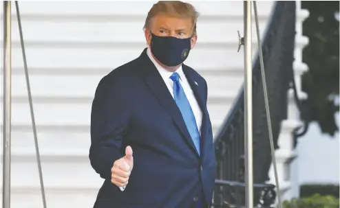  ?? SAUL LOEB / AFP via Gett y Imag es ?? President Donald Trump walks to Marine One on Friday prior to departure from the South Lawn of the White House as he heads to Walter Reed Military Medical Center.