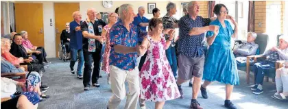  ?? Photo / Alison Smith ?? Moana House Whangamata residents get into the Beach Hop spirit with a visit from Coastal Rockers on Monday.