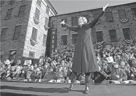  ??  ?? Sen. Elizabeth Warren, D-Mass., acknowledg­es cheers as she takes the stage during an event to formally launch her presidenti­al campaign Saturday in Lawrence, Mass. ELISE AMENDOLA/AP