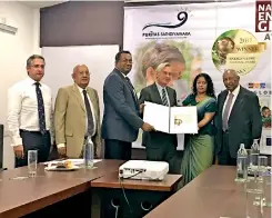  ??  ?? Haycarb Managing Director Rajitha Kariyawasa­n and Hayleys Puritas Director, Sharmila Ragunathan receiving the National Energy Globe Award Sri Lanka 2017 from Commercial Counsellor at the Embassy of Austria, New Delhi, India, Dr. Oska Andesner