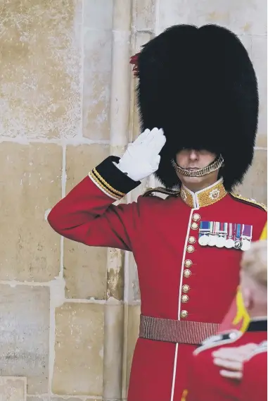  ?? ?? The coffin of Queen Elizabeth II, draped in the Royal Standard with the Imperial State Crown and the