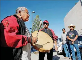  ?? [PHOTO BY JIM BECKEL, THE OKLAHOMAN ARCHIVES] ?? Germaine Tremmel, a Lakota Dakota who was in Oklahoma visiting relatives, joined other Native Americans and Tribal members to drum, dance and sing outside city hall in downtown Oklahoma City on Oct. 13, 2015, to advocate for Indigenous Peoples’ Day.