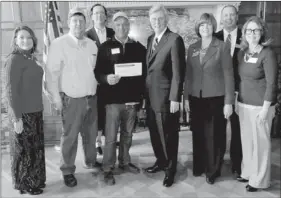  ?? COURTESY PHOTO ?? Lincoln Rural Fire Associatio­n Chief Willie Leming recently received a $73,000 grant award for a new fire station in Summers. Above: Cassie Elliott, Ralph Moore, ARDC Chair Bob Lucky, Lemming, Governor Mike Beebe, Representa­tive Charlene Fite, DRS...