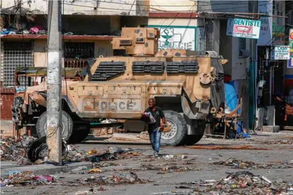  ?? ODELYN JOSEPH/AP ?? An armored police car patrolled the General Hospital area in Port-au-Prince on April 2.