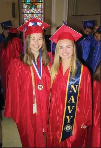  ?? Photos by Joseph B. Nadeau ?? At left, Salutatori­an Matthew Melnychuk delivers his address to fellow members of Mount St. Charles’ Class of 2018. Above, Rachel Breau, left, and U.S. Navy-bound Maggie Bouckaert pause before Sunday’s ceremonies.