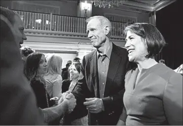  ?? ERIN HOOLEY/CHICAGO TRIBUNE ?? Republican Gov. Bruce Rauner and wife Diana greet supporters after he conceded defeat to Democrat J.B. Pritzker.