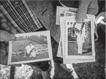  ?? BILL O’LEARY/WASHINGTON POST ?? Gary Bishop displays family snapshots of Herman Schmidt, Bishop’s granduncle, who was killed during the Dec. 7, 1941, attack on Pearl Harbor while serving aboard the USS Oklahoma.