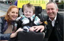  ?? Photo: Arthur Carron/Collins ?? Michael Stokes with his foster parents Ann Higgins and Barry McCabe at Croke Park in 2012.