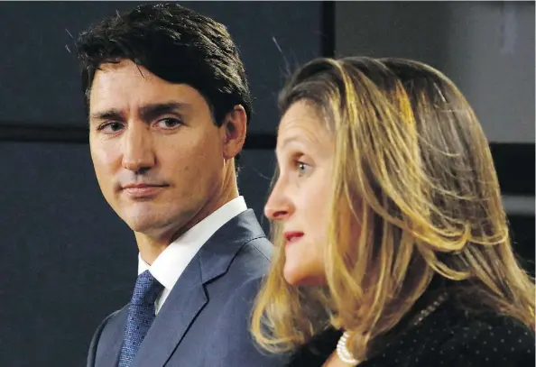  ?? PATRICK DOYLE/AFP/GETTY IMAGES FILES ?? Prime Minister Justin Trudeau and Foreign Affairs Minister Chrystia Freeland announce the new USMCA on Oct. 1. The USMCA is believed to have the strongest protection­s for intellectu­al property, which has frustrated critics who say they stifle innovation.