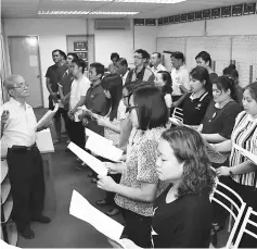  ??  ?? SUPP choir practising the youth song which they will perform at the anniversar­y celebratio­n dinner.
