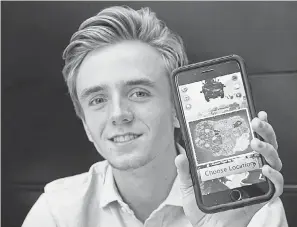  ?? JASON WACHTER/STCLOUDTIM­ES.COM ?? Robbie Jandik, 18, shows the app he developed for gamers who play “Fortnite.”