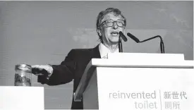  ?? Mark Schiefelbe­in / Associated Press ?? Billionair­e philanthro­pist Bill Gates presented a jar of human feces during his presentati­on at the “reinvented toilet expo” Tuesday in Beijing. Gates was promoting better sanitation technologi­es.