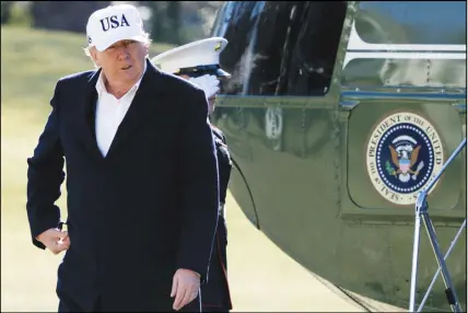  ?? Ap photo ?? President Donald Trump steps off Marine One on the South Lawn as he arrives at the White House in Washington on Sunday.