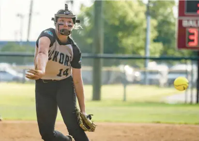  ?? MIKE CAUDILL/FREELANCE PHOTOS ?? Hickory pitcher Tegan Gabrielse delivers during the Class 5 Region A championsh­ip game against Kempsville last Thursday. The freshman is 15-4-1 on the mound and has also excelled at the plate, hitting .429.