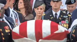  ?? DREW ANGERER/GETTY IMAGES ?? Cindy McCain watches as service members carry her husband’s casket after his funeral at Washington National Cathedral on Sept. 1.