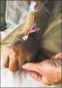  ?? Contribute­d Photo ?? Hearst Connecticu­t Media reporter and columnist Ken Dixon holds his father’s hand at Stamford Hospital. Claude Dixon, who died at 92 on Jan. 7, 2018, served in the U.S. Navy during World War II, taught in Stamford public schools and worked as a...