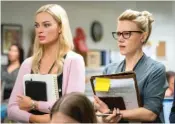  ??  ?? An ambitious producer (Margot Robbie, left) has a fling with a gay colleague (Kate McKinnon) in “Bombshell.”