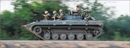  ?? Nampa/AFP ?? Fighting ongoing… Ukrainian soldiers ride on a BMP infantry fighting vehicle toward Bakhmut, on 20 May 2023, amid the Russian invasion of Ukraine.