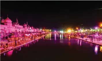  ?? — PTI ?? Devotees light lamps on Deepotsav at Ramghat on the eve of ‘bhumi pujan’ of the Ram Mandir in Ayodhya on Tuesday. Prime Minister Narendra Modi is scheduled to attend the ceremony to be held on Wednesday.