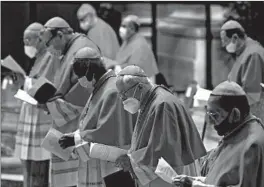  ?? FABIO FRUSTACI/AP ?? Cardinals wear masks as they attend a consistory ceremony Saturday at the Vatican.