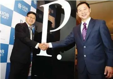  ??  ?? Enhanced perks: UOB (M) Bhd CEO Chan Kok Seong (left) and managing director/country head of personal financial services Kevin Lam at the launch of UOB’S Enhanced Privilege Banking. > See page 2