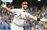  ?? KEITH BIRMINGHAM/
PASADENA STAR-NEWS/SCNG ?? Albert Pujols celebrates after hitting his second home run — the 700th of his career — off of Dodgers relief pitcher Phil Bickford during the fourth inning Friday night at Dodger Stadium in Los Angeles. Pujols is just the fourth major league player to reach the milestone.