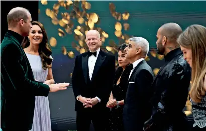  ?? Reuters ?? Britain’s Prince William and Catherine, Duchess of Cambridge, speak with Sadiq Khan, Saadiya Khan, Dani Alves and William Hague during the first Earthshot awards ceremony at Alexandra Palace in London on Monday. —