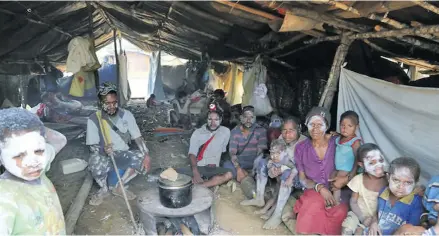  ??  ?? A group of people in one of the areas hit by the PNG earthquake