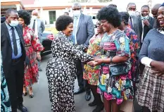  ?? Pictures: John Manzongo ?? Angel of Hope founder and patron First Lady Dr Auxillia Mnangagwa shares a lighter moment with guests who were dressed in the yesteryear fashion style including the Afro haistyle during the fundraisin­g dinner at State House on Friday. —