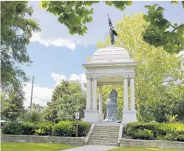  ?? BOB SELF/THE FLORIDA TIMES-UNION VIA AP ?? A statue honoring the Women of the Confederac­y sits in Springfiel­d’s Confederat­e Park on July 2, 2020, in Jacksonvil­le. The statue been wrapped up and is out of view with plans for it to be removed as part of the city’s plans to remove several Confederat­e Monuments and a number of historic markers related to the Civil War. A proposal to remove the Confederat­e monument has been withdrawn after a heated debate that ended with the audience being ordered out of City Council chambers.