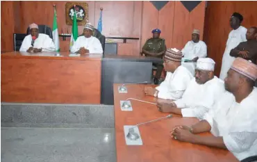  ?? Gov. Abdullahi Umar Ganduje of Kano State (first left) speaking when he paid a sympathy visit to Governor Ibrahim Gaidam of Yobe State (second left) over the incident at GGSTC Dapchi at Government House Damaturu yesterday. PHOTO: ??