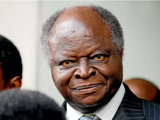  ?? AP ?? Mwai Kibaki in 2008, the year in which he agreed a powershari­ng deal with presidenti­al rival Raila Odinga. Kibaki’s disputed victory the previous year led to widespread violence in which more than 1100 people died.