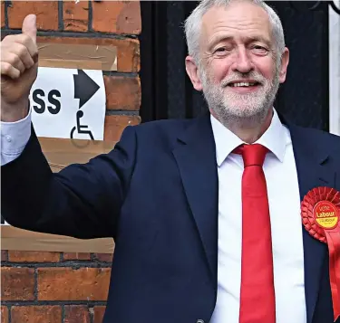  ??  ?? Thumbs up: Jeremy Corbyn casts his vote in his Islington North constituen­cy yesterday