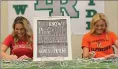  ?? MIKE BUSH/NEWS-SENTINEL ?? Carson Jackson (left) and Karlie Hintze share a laugh after signing their National Letter of Intent signing inside the Liberty Ranch High library on May 10. Jackson is going to Stanislaus State and Hintze to Jamestown University.